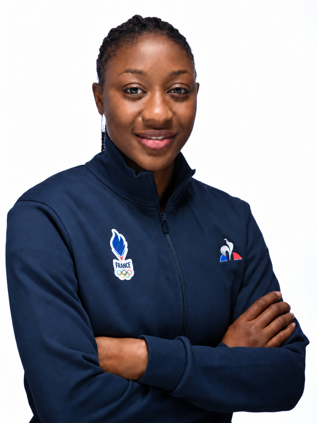 Kadidiatou Diani smiling, arms crossed in a France team jacket